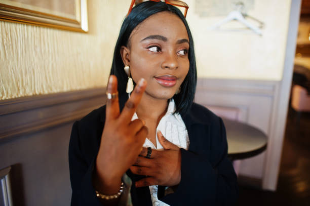 istock Young deaf mute african american woman using sign language. 1326084181