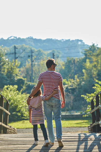 istock Daughter and father enjoying outdoors nature. 1326085016