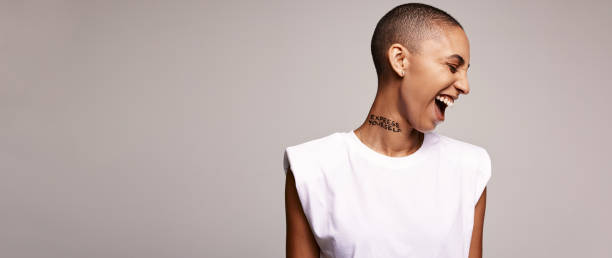 istock Excited woman with shaved head 1326085258