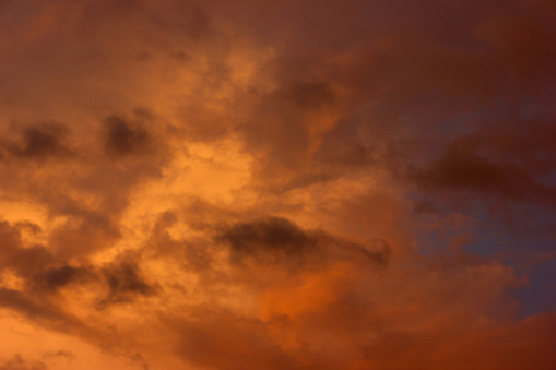 Background bright evening sky with clouds at sunset. Stock photography.