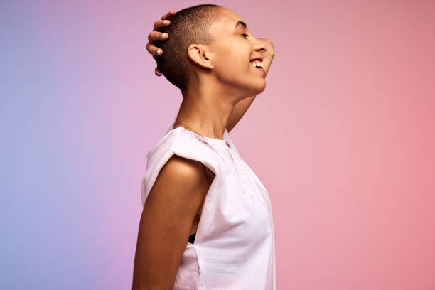 istock Androgynous woman standing against background 1326085336