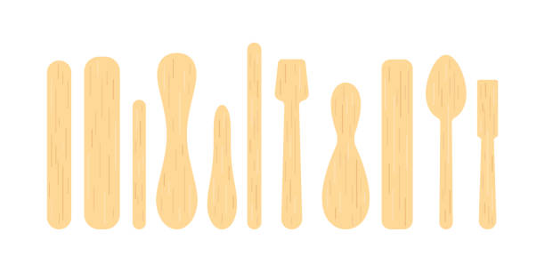 Popsicle stick and wood spoon for ice cream, medical tongue depressor set. Popsicle stick and wood spoon for ice cream, medical tongue depressor set. Different wooden stick for medical throat examination, sundae and frozen yoghurt. Flat cartoon vector clip art illustration popsicle stick stock illustrations