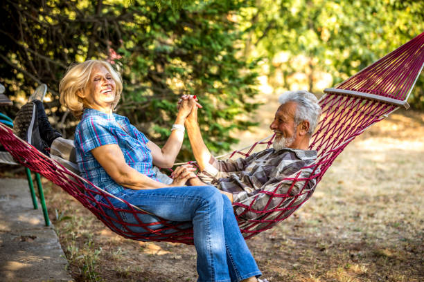 istock Senior couple relaxing in a hammock 1326087488