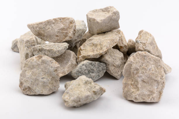 istock Gray small rocks ground texture isolated on white background. Small road stone. 1326088642