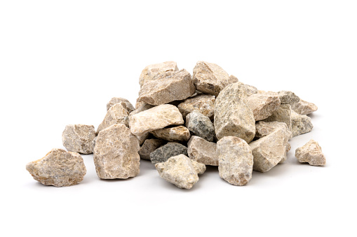 Gray small rocks ground texture isolated on white background. Small road stone. Gravel pebbles stone. crushed granite gravel, close up.