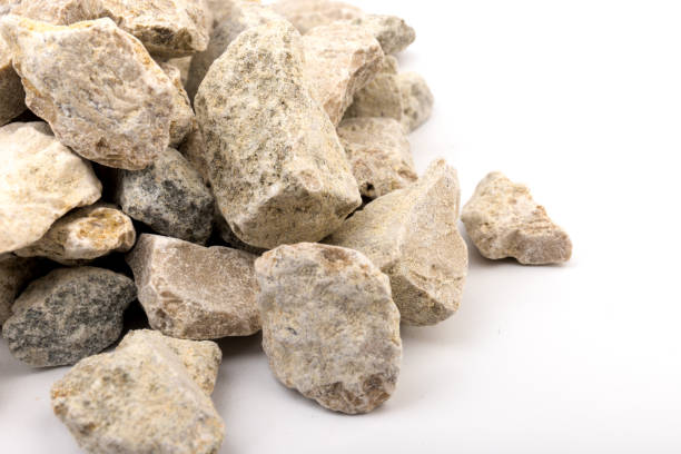 istock Gray small rocks ground texture isolated on white background. Small road stone. 1326088769