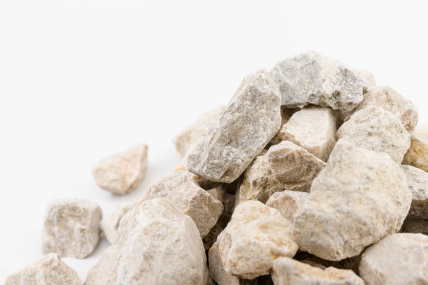 istock Gray small rocks ground texture isolated on white background. Small road stone. 1326088835