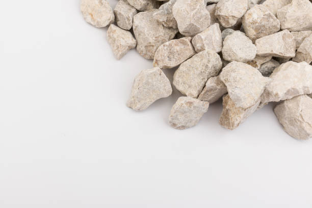 istock Gray small rocks ground texture isolated on white background. Small road stone. 1326089077