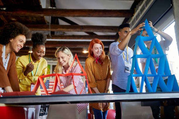 istock Group of young creative employees are playing games in the office 1326090835
