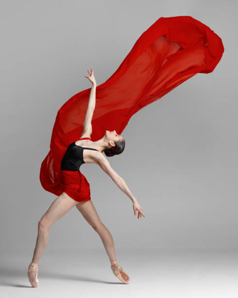 istock Young beautiful skinny ballerina is posing in studio 1326092373