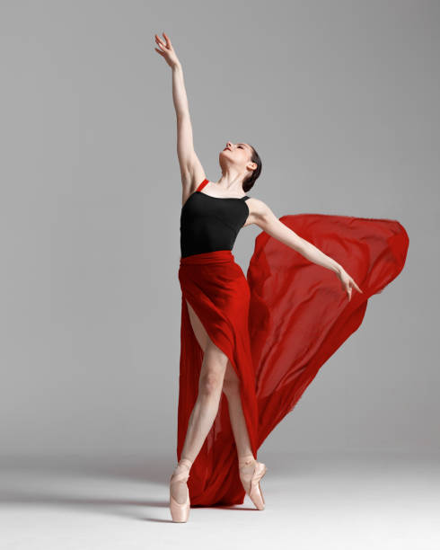 istock Young beautiful skinny ballerina is posing in studio 1326092461