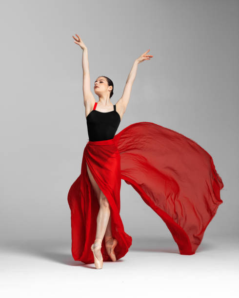 istock Young beautiful skinny ballerina is posing in studio 1326092505
