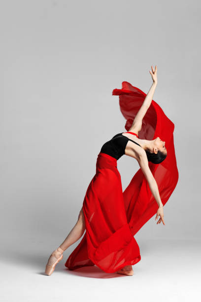 istock Young beautiful skinny ballerina is posing in studio 1326092624