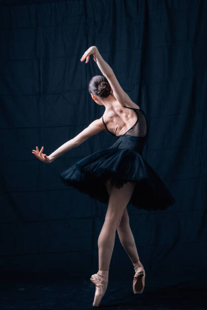 istock Young beautiful skinny ballerina is posing in studio 1326092719