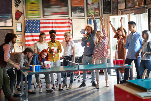 istock A group of young cheerful creative people is doing on team building by playing games at workplace. Employees, office, work 1326092781