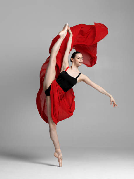 istock Young beautiful skinny ballerina is posing in studio 1326092824