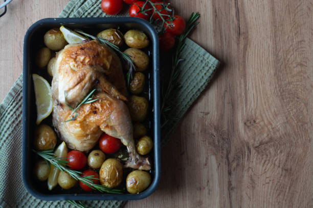 istock baked chicken with mushrooms and potatoes close-up in a baking dish on a table. horizontal top view from above 1326092884
