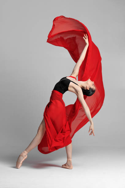 istock Young beautiful skinny ballerina is posing in studio 1326093027