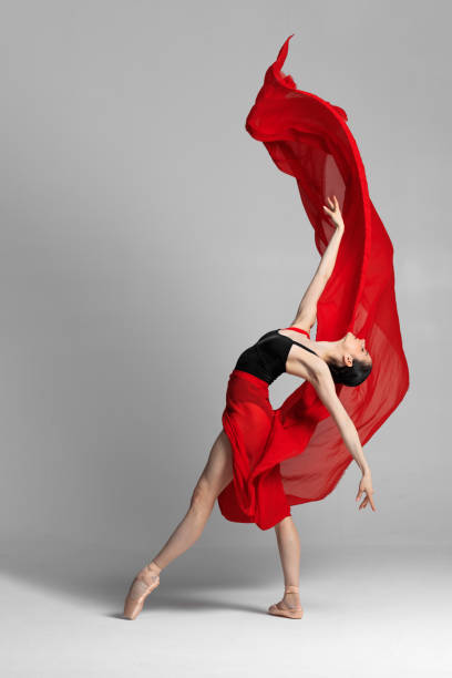 istock Young beautiful skinny ballerina is posing in studio 1326093058