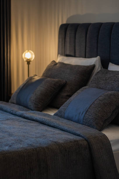 istock modern bedroom with bed by the window, dark colors 1326093373