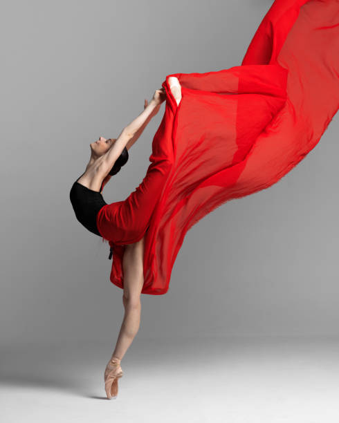 istock Young beautiful skinny ballerina is posing in studio 1326093376