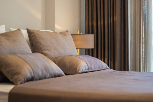 modern bedroom with bed by the window, dark colors