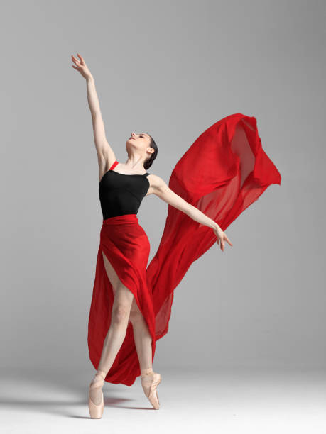 istock Young beautiful skinny ballerina is posing in studio 1326094023