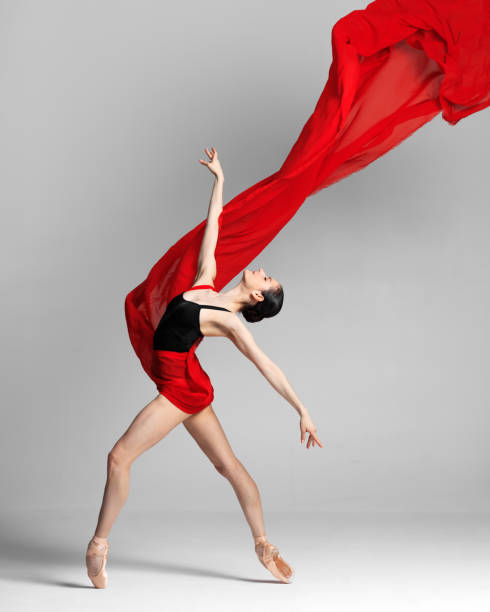 istock Young beautiful skinny ballerina is posing in studio 1326094459
