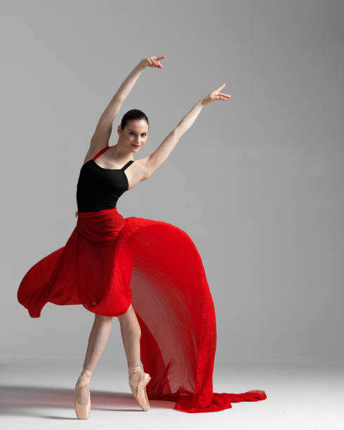 istock Young beautiful skinny ballerina is posing in studio 1326094639