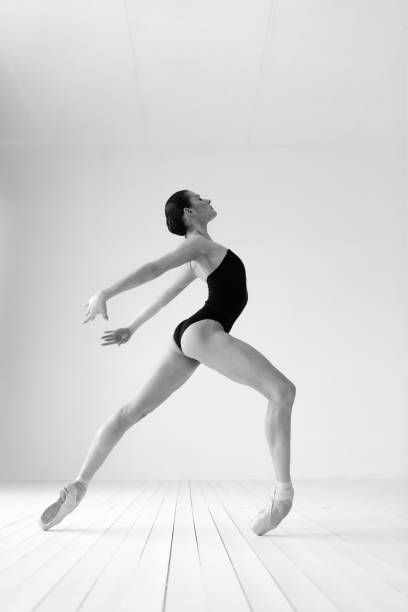 istock Young beautiful skinny ballerina is posing in studio 1326094746