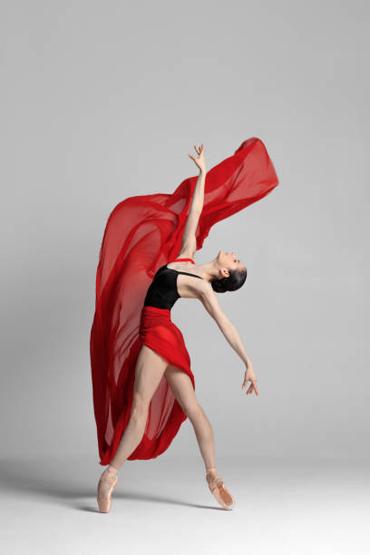 istock Young beautiful skinny ballerina is posing in studio 1326095554
