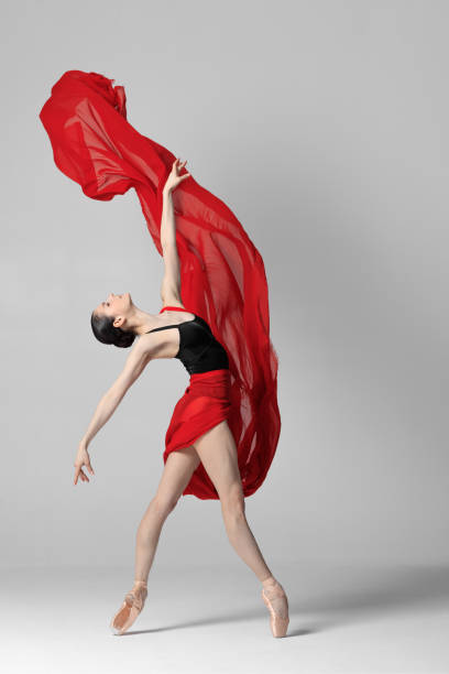 istock Young beautiful skinny ballerina is posing in studio 1326096109