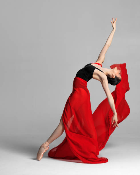 istock Young beautiful skinny ballerina is posing in studio 1326096202