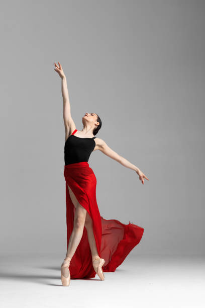 istock Young beautiful skinny ballerina is posing in studio 1326096255