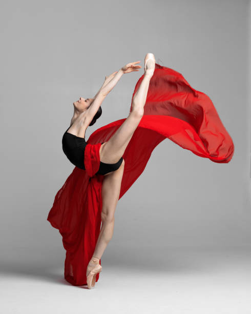 istock Young beautiful skinny ballerina is posing in studio 1326096314