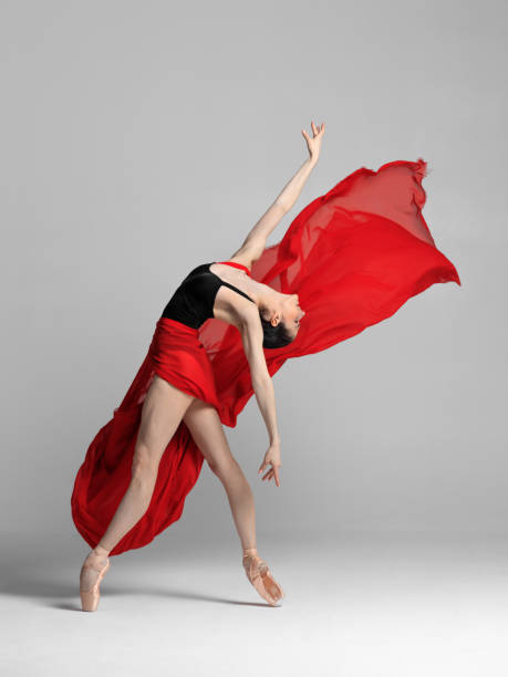 istock Young beautiful skinny ballerina is posing in studio 1326096340
