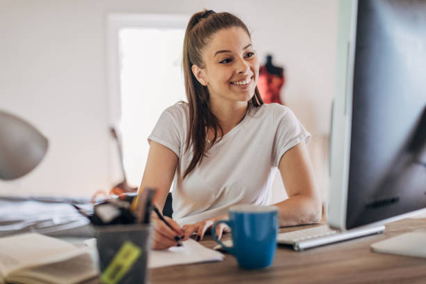 istock Young woman studying at home 1326097450