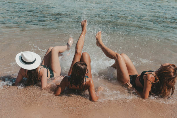 istock Group of beautiful young women have a rest on a beach. 1326097907