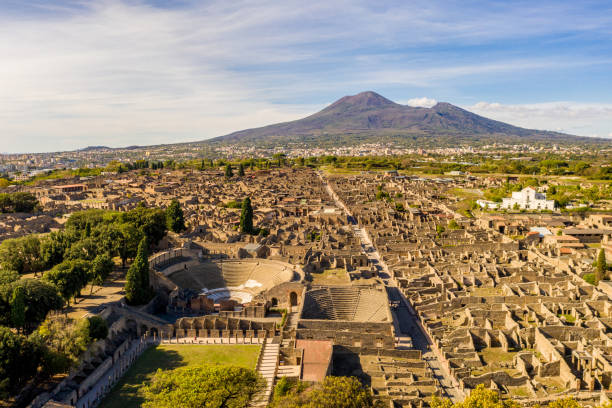 Mount Vesuvius And Pompeii Ruins Aerial View Of Pompeii With Mount Vesuvius In The Background ancient greece stock pictures, royalty-free photos & images