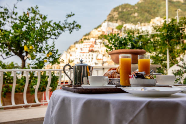 Breakfast Table Against View Of Positano Close-up Of Breakfast Table On The Balcony Of A Hotel Against View Of Positano amalfi food stock pictures, royalty-free photos & images