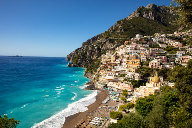View Of The Positano Town And The Seaside Aerial View Of The Positano Town And The Seaside In A Summer Sunset sorrento italy photos stock pictures, royalty-free photos & images