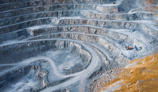 istock Open pit stone quarry with terraces and colorful tailings 1326100108