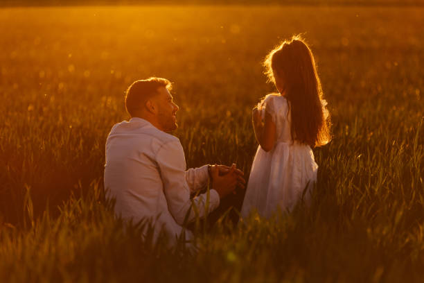 istock Father and daughter enjoying nature together 1326100277
