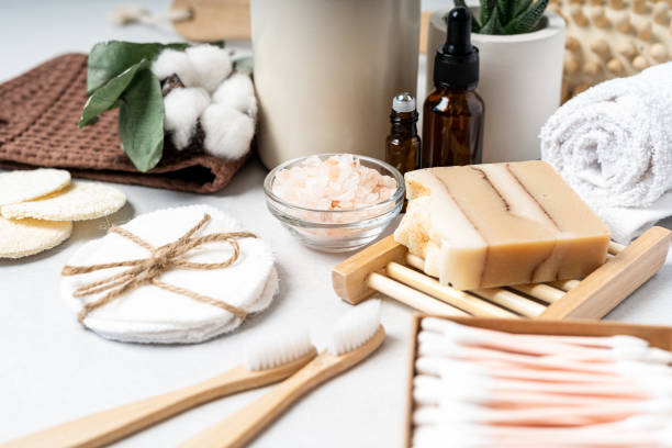 istock Natural bathroom and home spa tools. Zero waste sustainable lifestyle concept. Bamboo toothbrush, natural soap bar, cotton pads, homemade DIY beauty products in reusable bottles on white background 1326100398