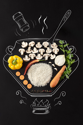 Creative cuisine. Cooking pot on fire. Set of ingredients for cream mushrooms soup. Mushrooms, rice, onion, carrot and pepper. Artwork. Drawn in chalk. Concept of healthy eating, food and cooking.