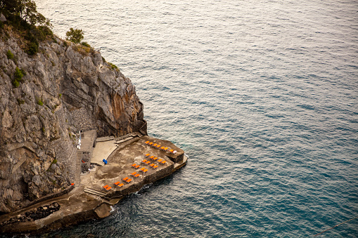 Aerial View Of A Hill With Lounge Chairs Near Ocean,Positano At Amalfi Coastline,Italy