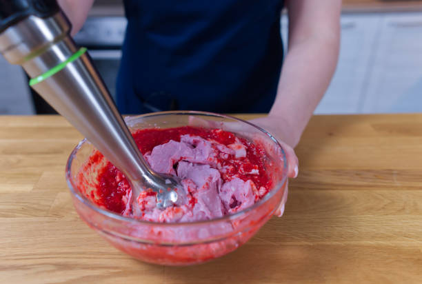 istock ice cream cooking process from strawberries and yogurt in a bowl with a blender 1326101318