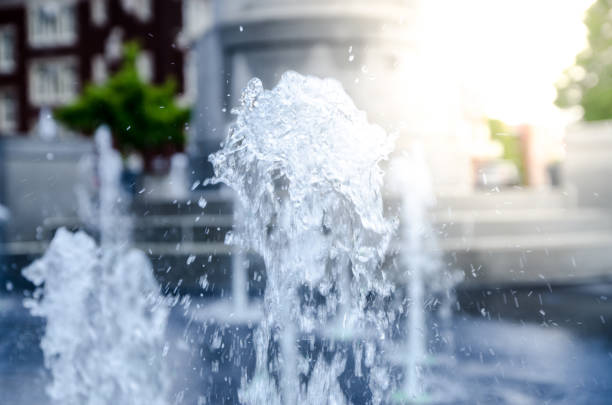 Vertical water jet from public fountain Vertical water jet from public fountain during day of summer with sunlight in Trois-Rivières, Québec, Canada canada close up color image day stock pictures, royalty-free photos & images