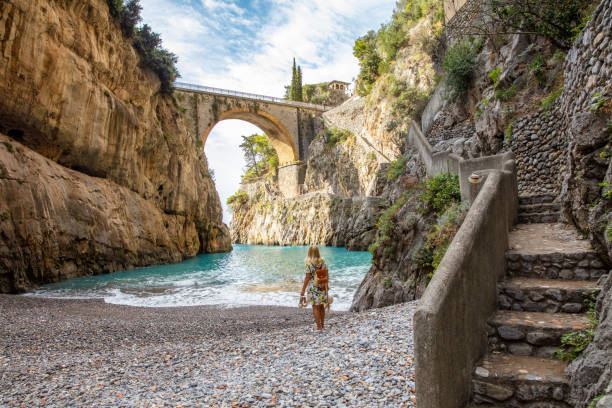 Woman At Fiordo Di Furore Bridge,Amalfi,Italy Young Beautiful Woman Admiring Fiordo Di Furore Beach At Positano,Amalfi,Italy sorrento italy photos stock pictures, royalty-free photos & images