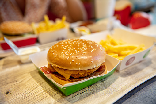 Close-up Of Burger And French Fries On Table